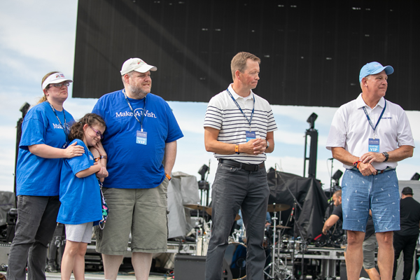 The day after the golf tournament, Chartway partnered with Make-a-Wish Utah for an on-stage surprise during Country Fan Fest 2021, presented by Chartway. They held a Wish Proclamation for 10-year-old Sylvia, who recently received a kidney transplant after battling end-stage kidney disease. George Sauer, Chartway’s board chair, Brian Schools, Chartway’s president & CEO, Karen Lane, executive director of Chartway’s We Promise Foundation, and Jared Perry, the CEO of Make-a-Wish Utah, announced that her “Wish” to have a shopping spree had been funded by Chartway and would be granted by Make-A-Wish Utah. Pictured (left to right): Sylvia and her family, Make-a-Wish Utah CEO, Jared Perry, and Chartway president & CEO, Brian Schools.